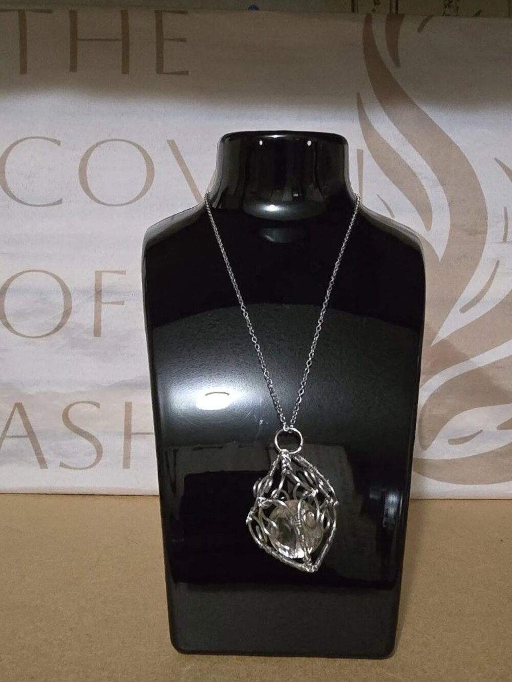Wire wrapped heart cage with clear quartz sphere
